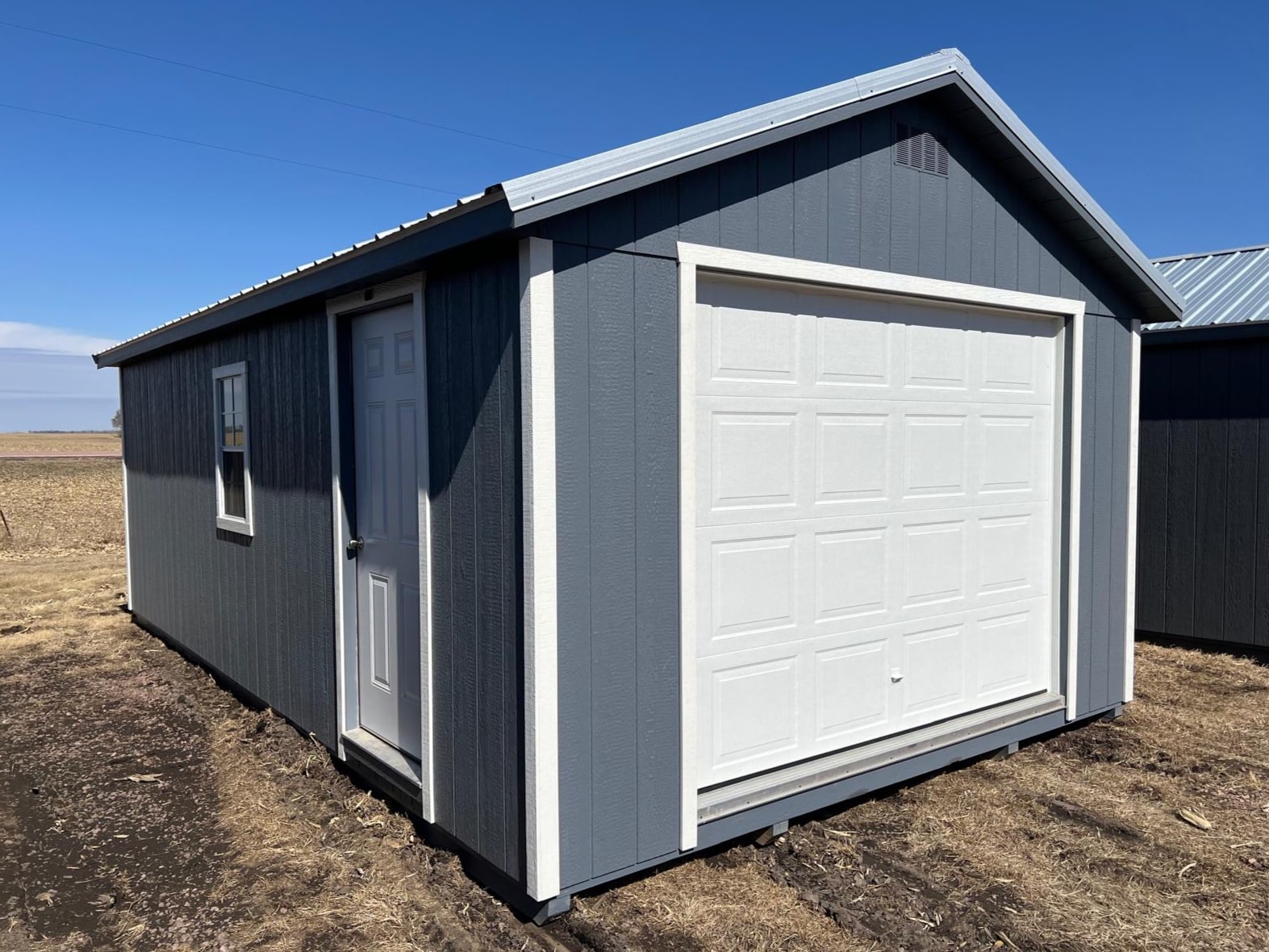 12x20 Gibraltar blue garage with white garage and side door, white trim and steel metal roof in South Dakota