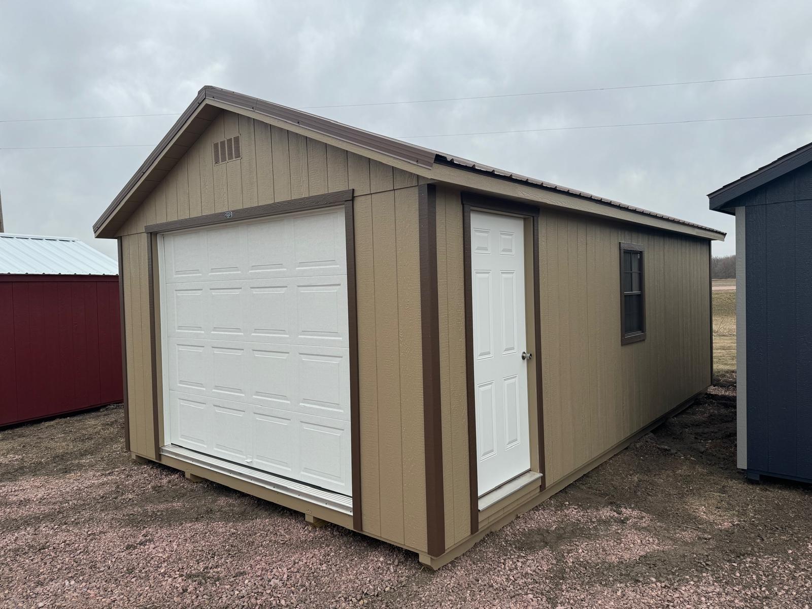 12x20 Sandy Ridge Tan Garage with white garage door and white side door, brown trim and matching brown steel metal roof in South Dakota
