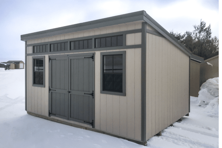 A shed for sale in Iowa sitting in the snow