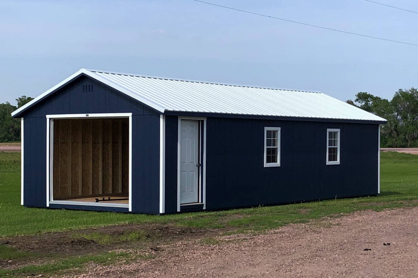 14x26 garage with blue siding and a white metal roof