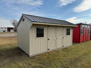 Tan Quaker shed in shed lot