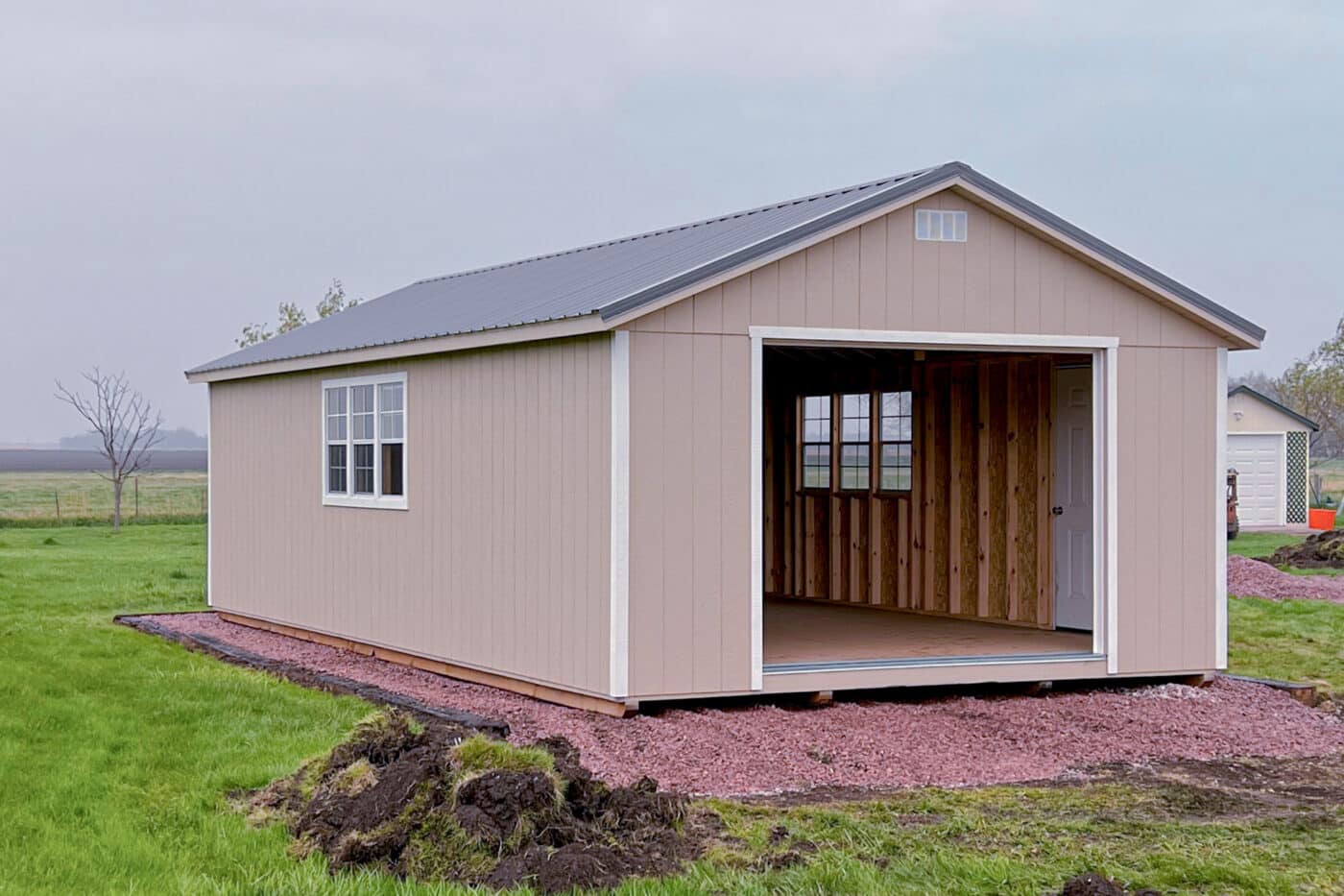 Brown a-frame garage with open door