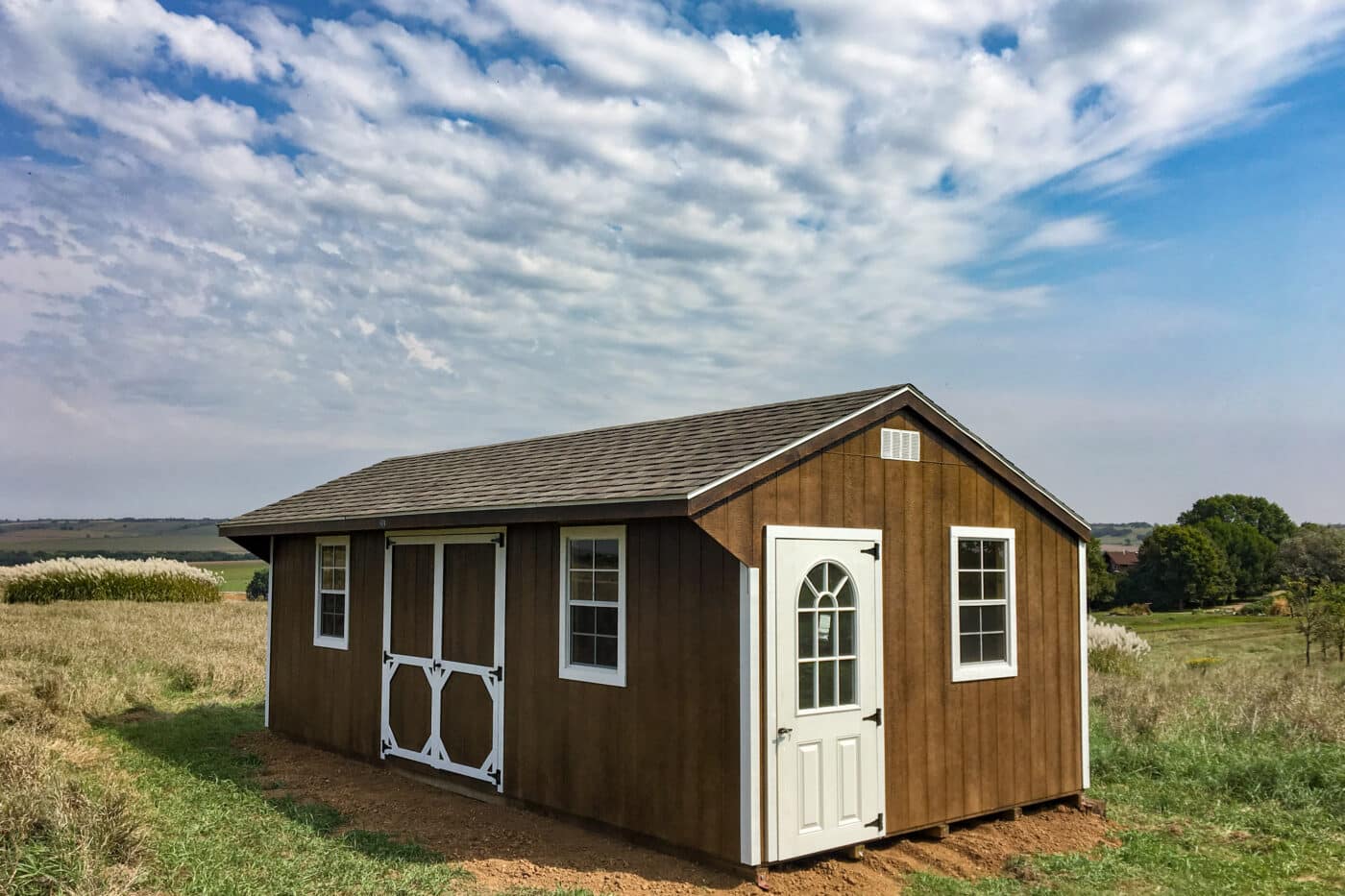 Brown Quaker storage shed in field