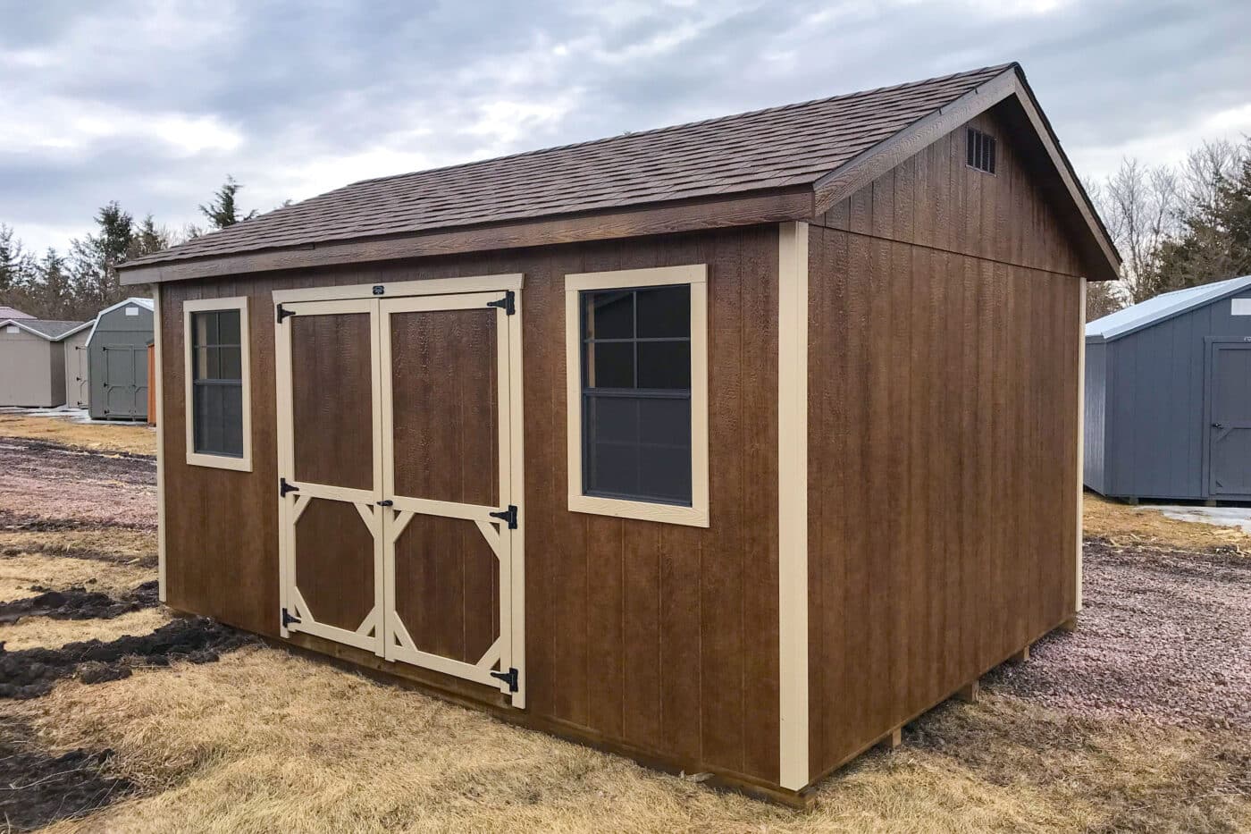 Brown and tan Ranch Prefab Shed in storage shed lot