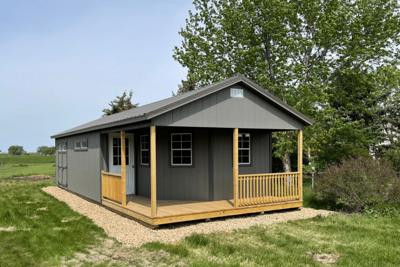 Gray a-frame cabin shed in backyard
