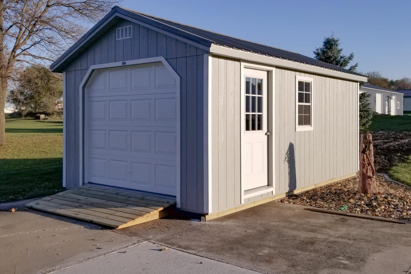 Grey A-Frame detached garage in backyard