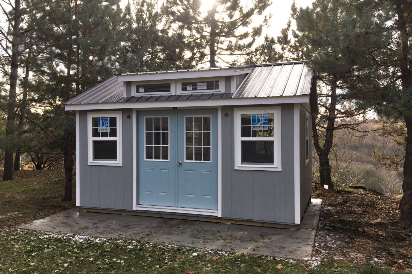Gray Blue Door Southern Classic Shed in Yard