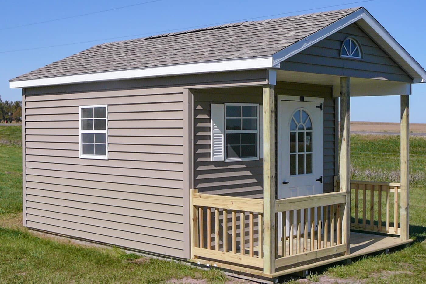 Gray playhouse with porch
