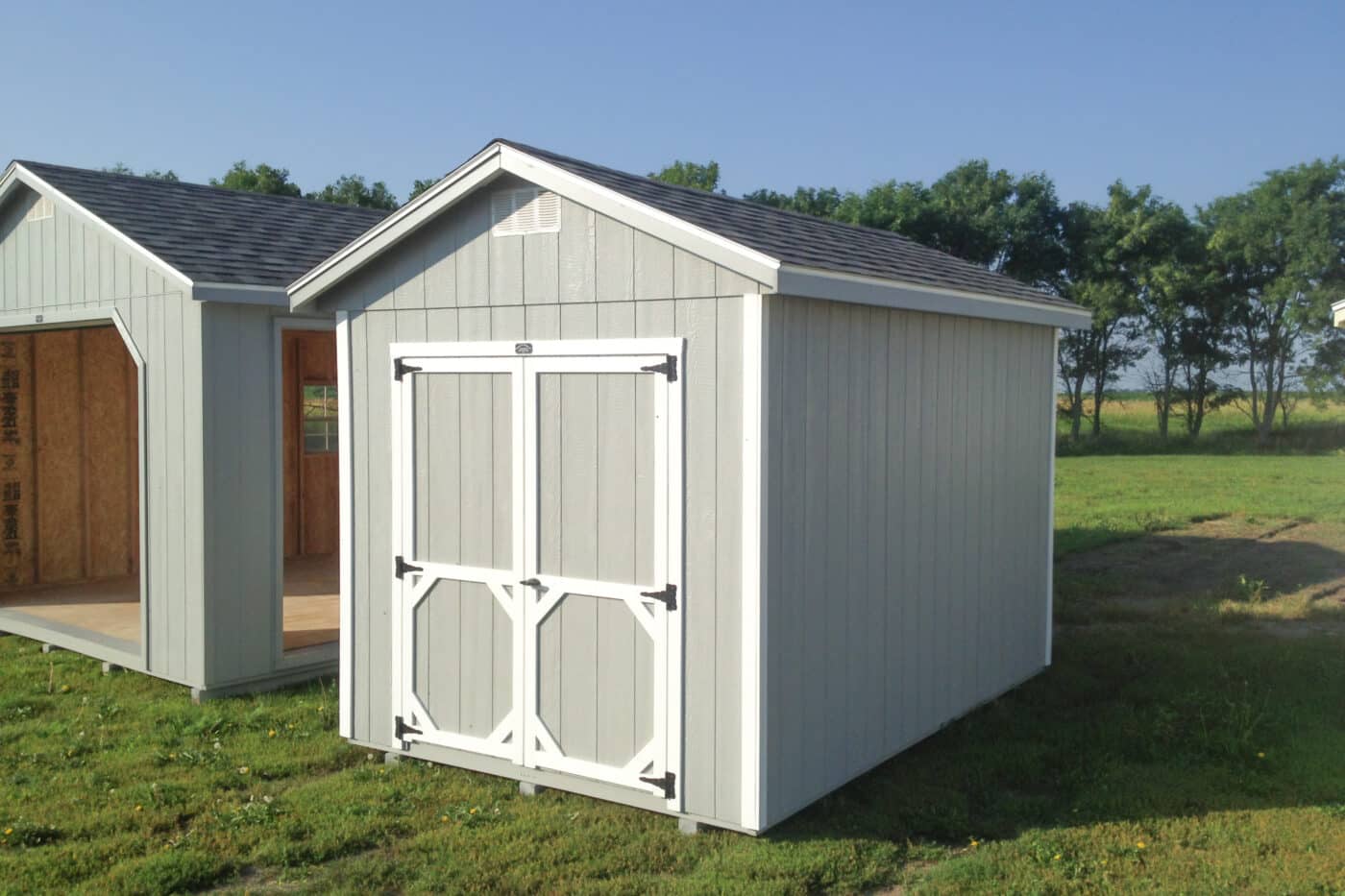 Gray Ranch Style gable shed in storage shed lot