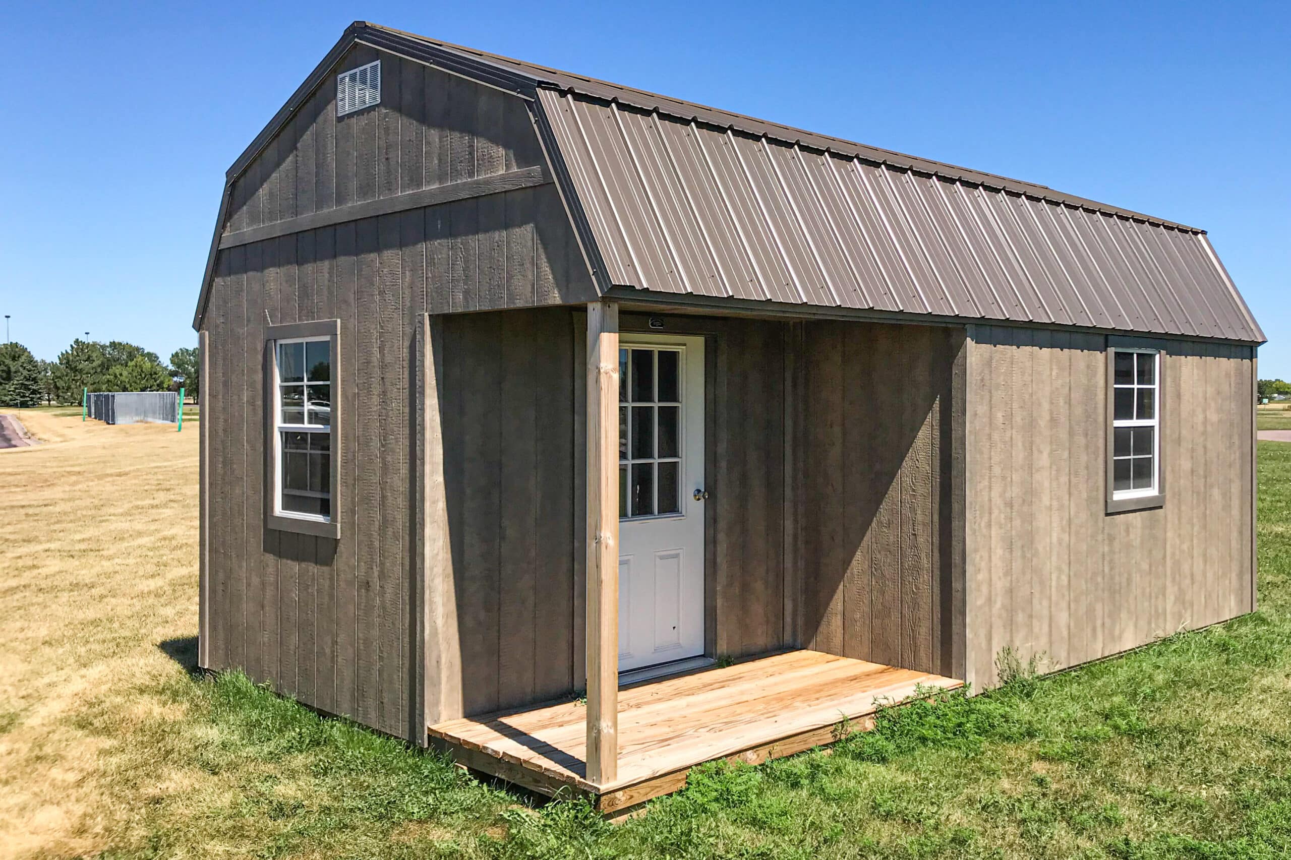 High barn storage shed with porch