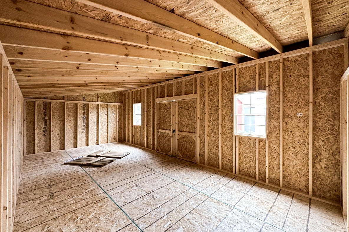 interior of a large flat roofed facing the back of the main door and front of the shed.