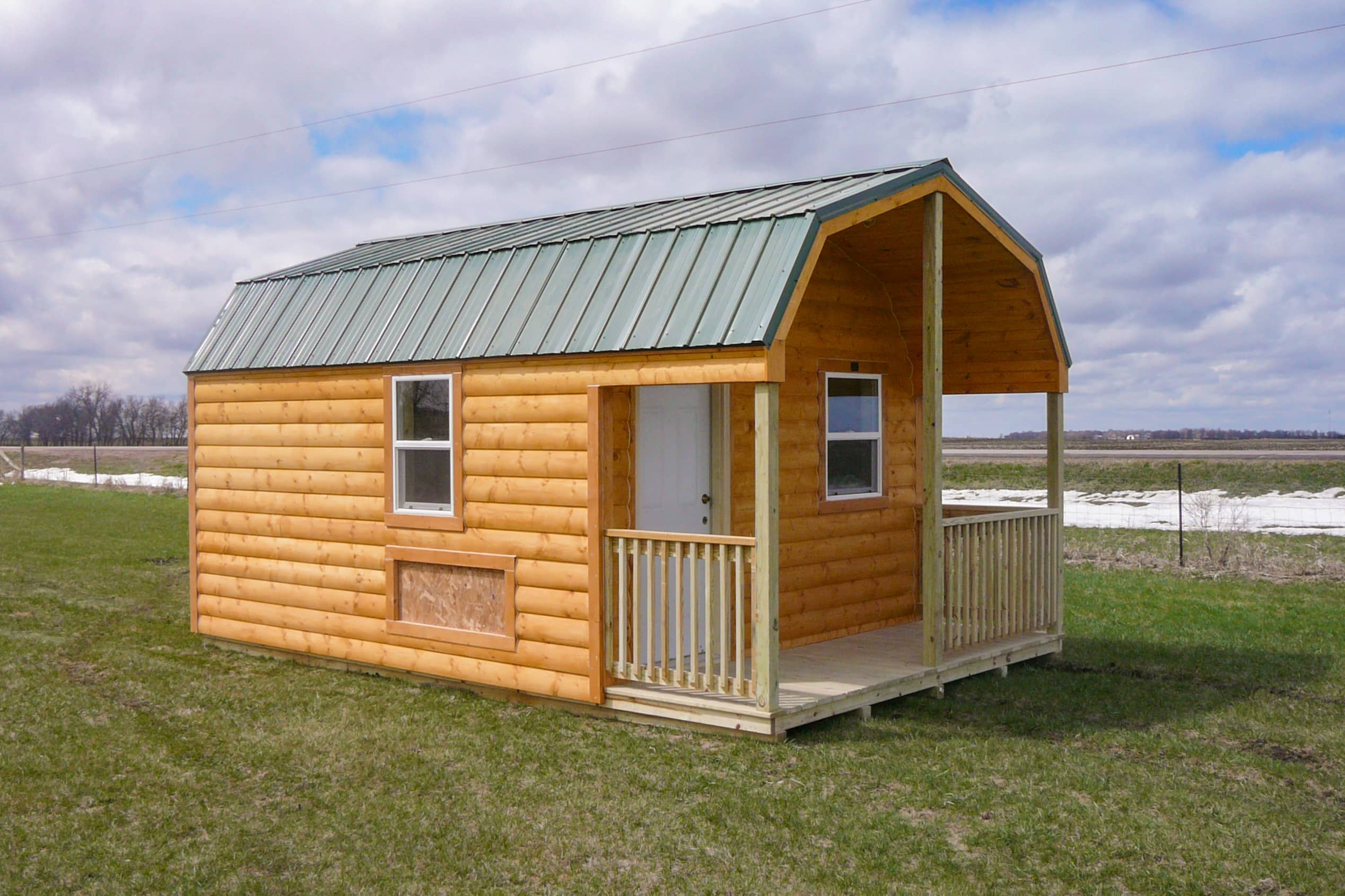 High barn cabin in field