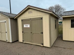 Beige Ranch shed in shed lot
