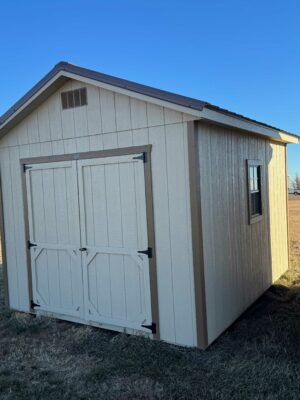 Beige Ranch shed in shed lot
