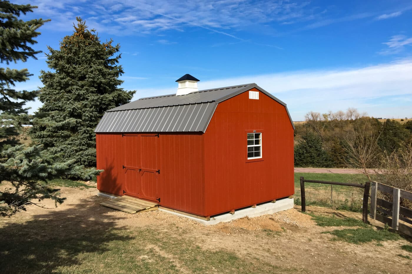 Red High Barn Storage Shed with Small Cupola