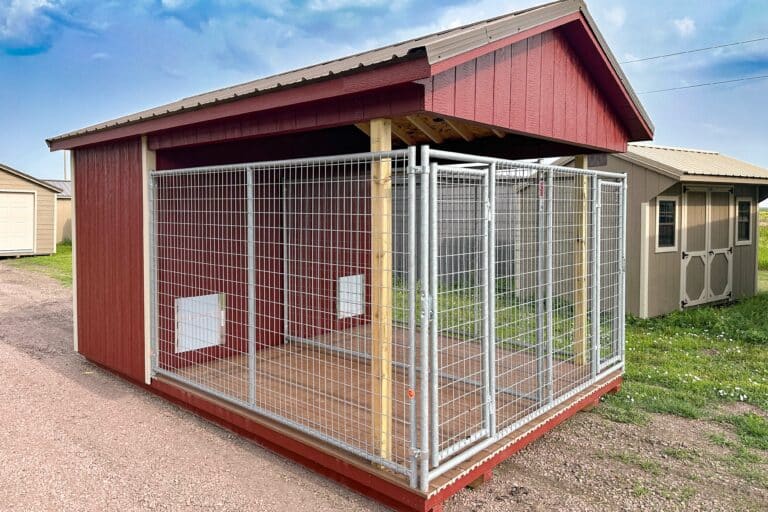 Red backyard dog kennel in storage shed lot