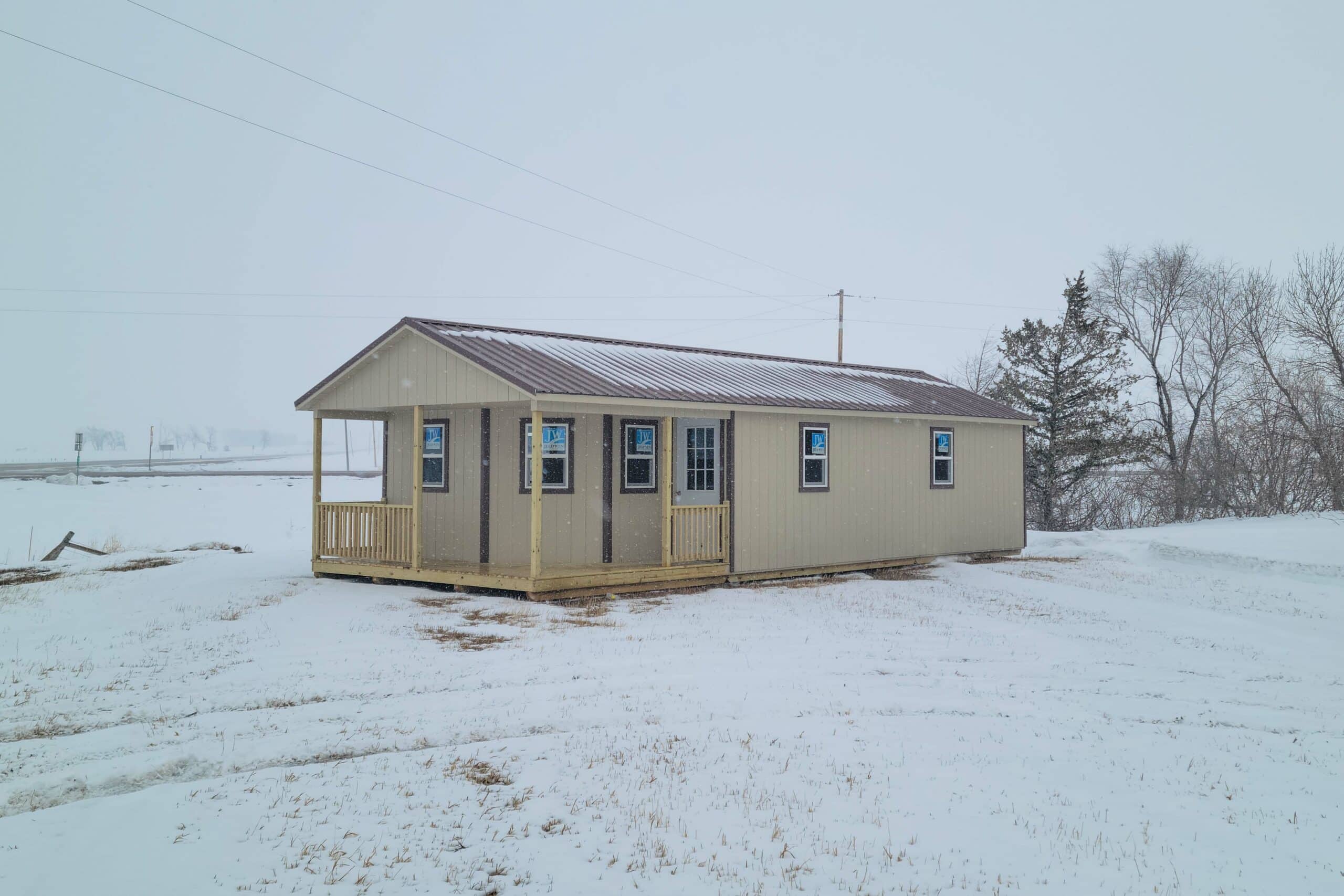 Snow cabin with wraparound porch