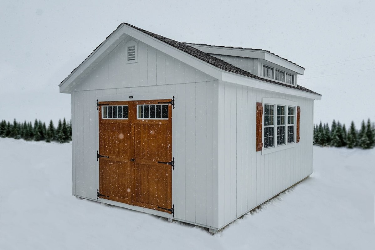 Snow falling on southern classic storage shed