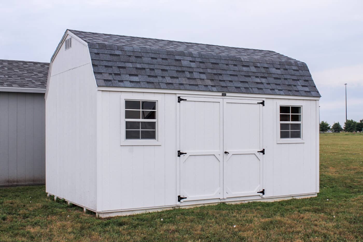 White High Barn shed in storage shed lot