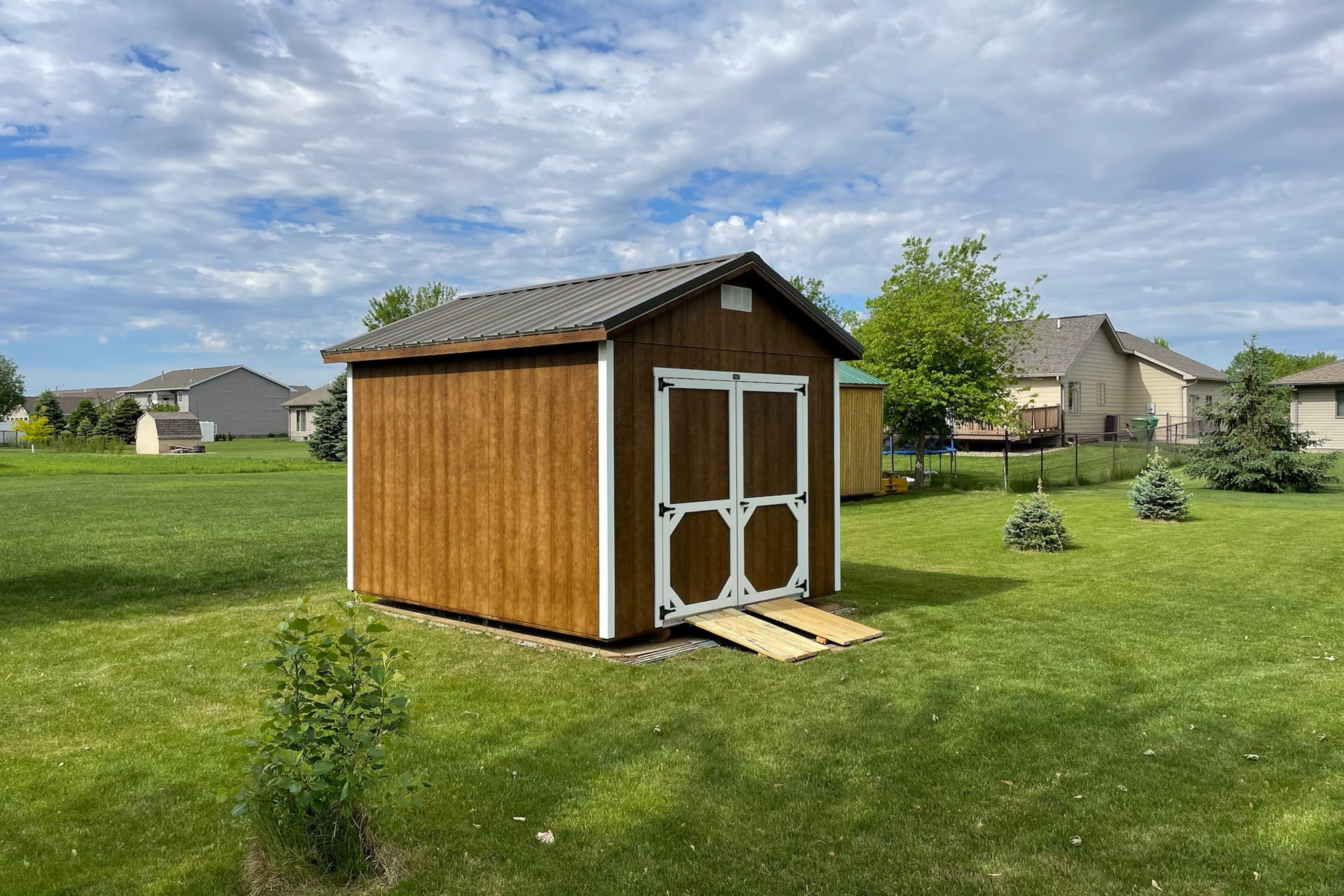 Brown wooden ranch storage shed
