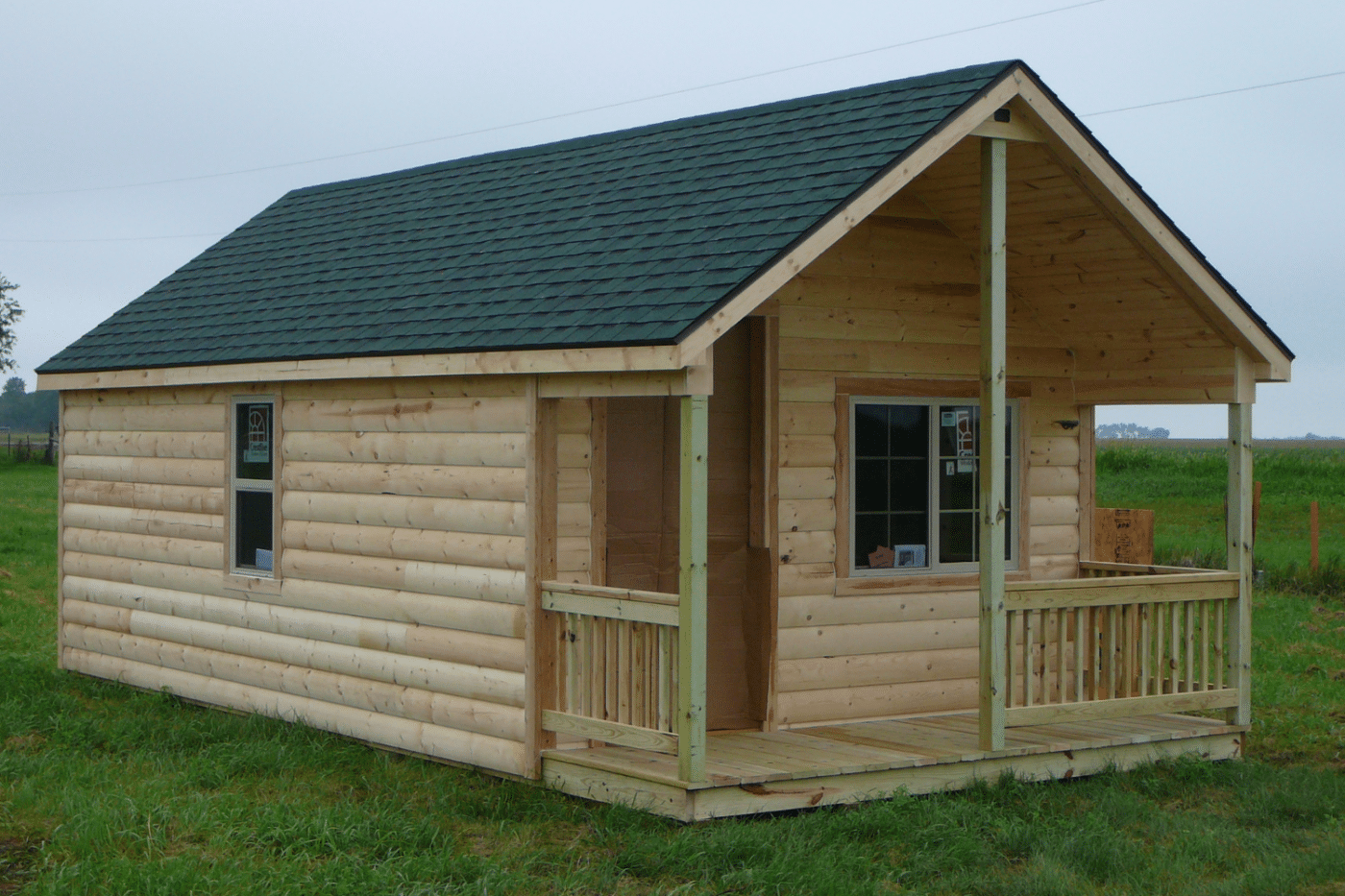 wooden cabin with green roof in brandon sd