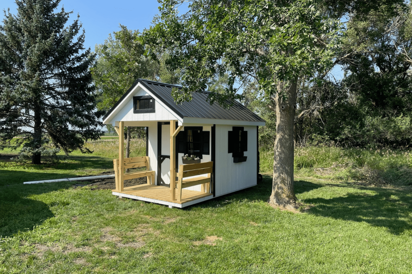 white and black playhouse near tree in brandon sd