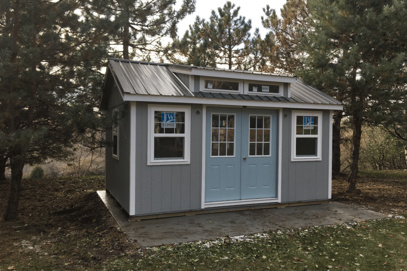 grey and blue southern classic shed in hartford sd